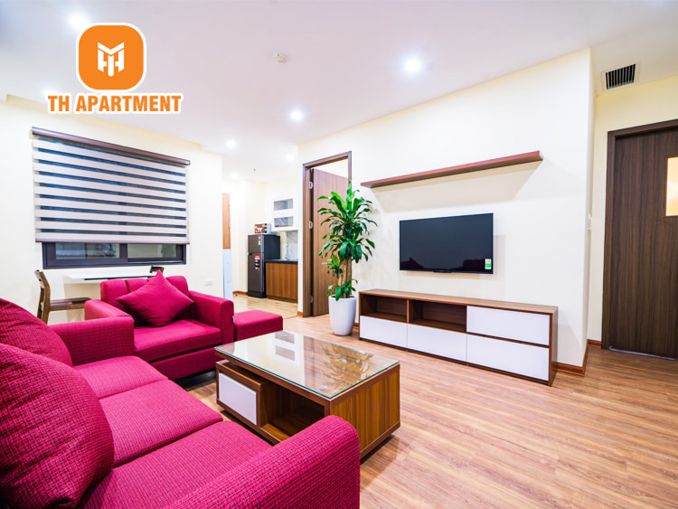 View phòng khách và phòng bếp với đầy đủ tiện nghi sang trọng bên trong căn hộ 1 phòng ngủ, 1 phòng khách, phòng bếp riêng biệt rộng 50m2